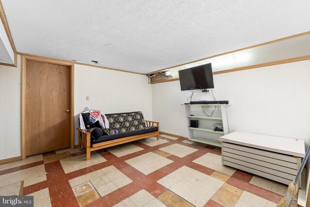 sitting room featuring a textured ceiling