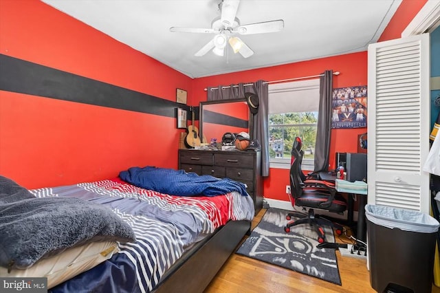 bedroom featuring ceiling fan and light wood-type flooring