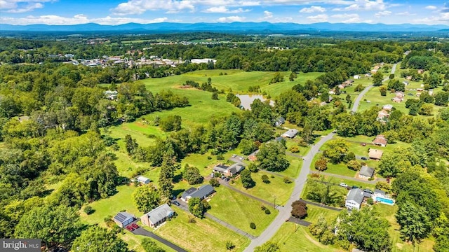 birds eye view of property featuring a mountain view