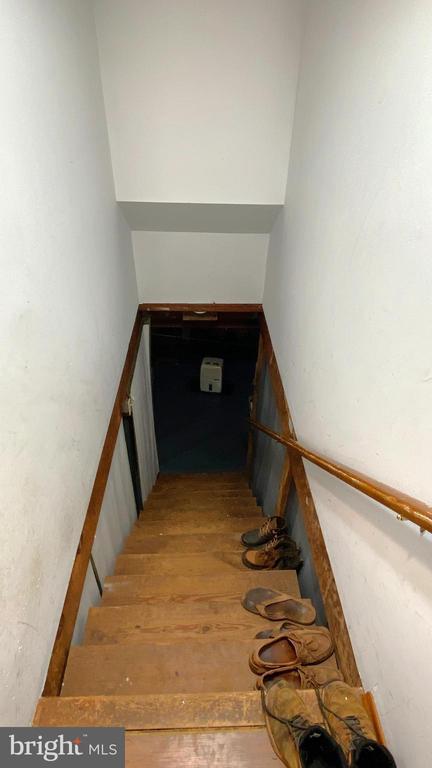 stairway featuring hardwood / wood-style flooring