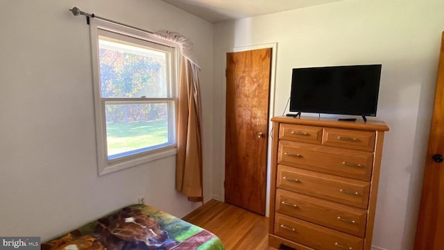 bedroom with light wood-style floors