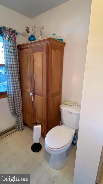 bathroom with tile patterned floors and toilet