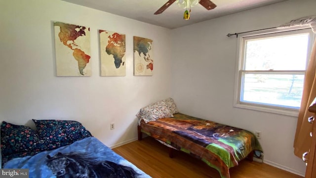 bedroom featuring hardwood / wood-style flooring and ceiling fan