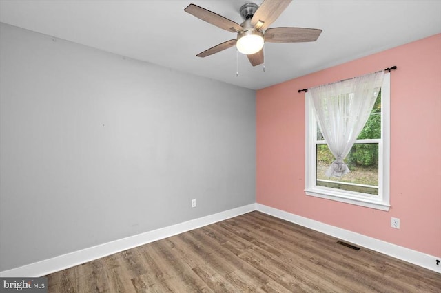 spare room with ceiling fan and hardwood / wood-style floors