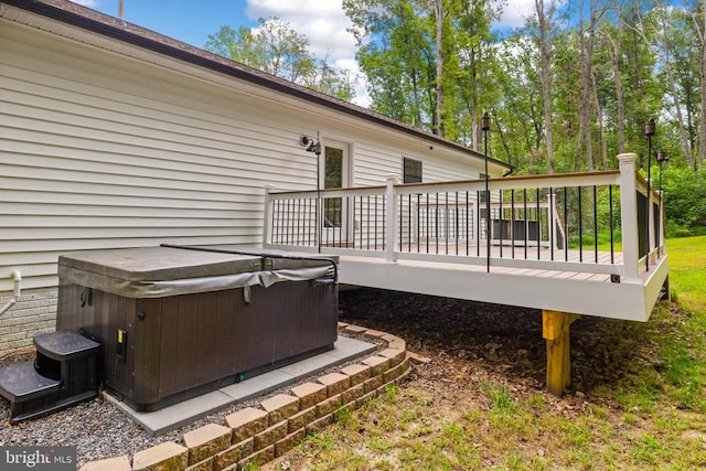 deck featuring a hot tub