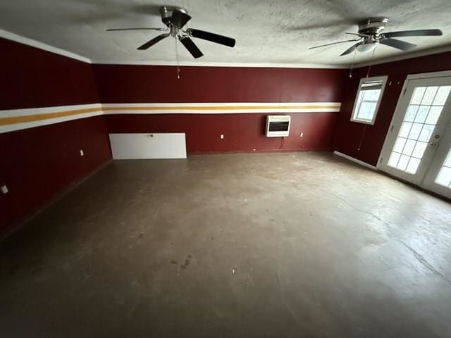 unfurnished room with a ceiling fan, concrete floors, and heating unit