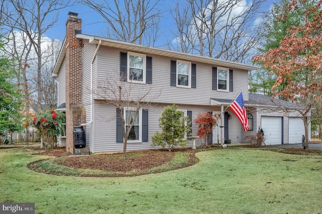 view of front facade featuring a garage and a front lawn