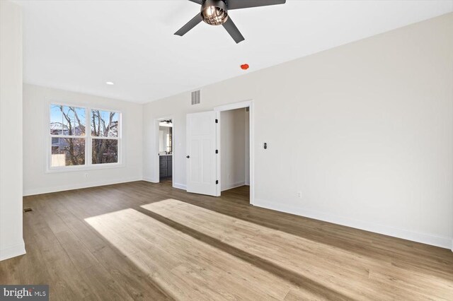 interior space featuring hardwood / wood-style flooring and ceiling fan