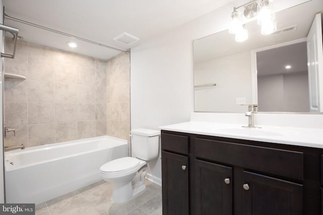 full bathroom with tile patterned floors, vanity, toilet, and tiled shower / bath combo