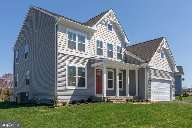 craftsman-style house with a garage, central AC, and a front lawn