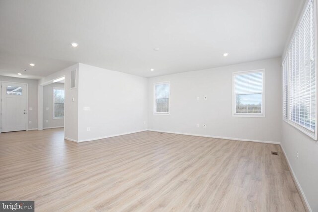 unfurnished room featuring light wood-type flooring