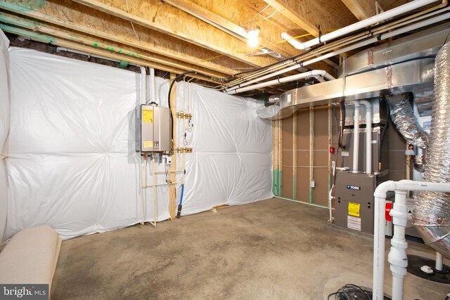 basement featuring tankless water heater