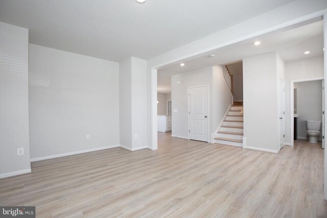 unfurnished living room featuring light hardwood / wood-style flooring