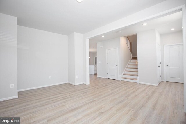 spare room featuring light hardwood / wood-style floors