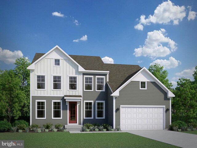 view of front of home featuring a garage and a front lawn