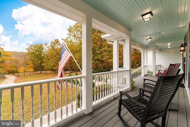 wooden deck featuring covered porch