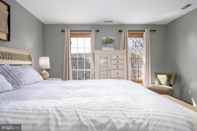 bedroom with carpet floors and visible vents