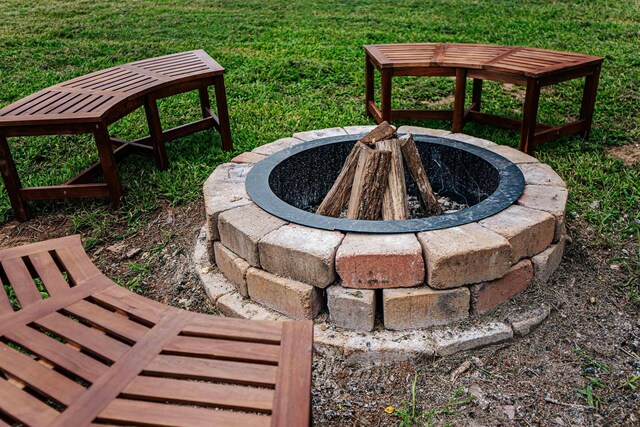 view of yard with an outdoor fire pit