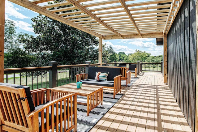 wooden deck featuring an outdoor hangout area and a pergola