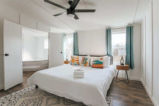 bedroom featuring lofted ceiling, dark hardwood / wood-style floors, and ceiling fan