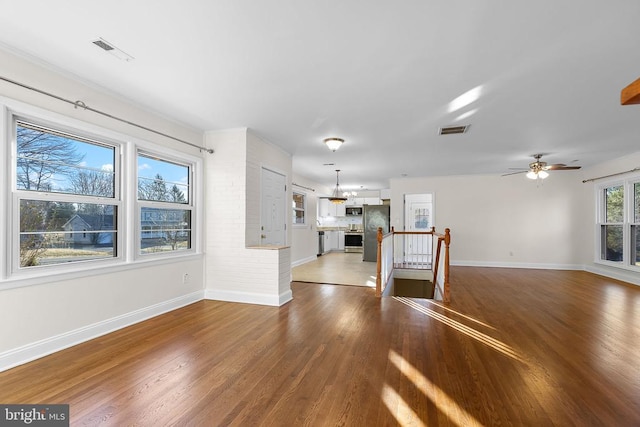 unfurnished living room with wood-type flooring and a fireplace