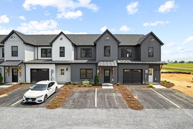 modern farmhouse featuring a garage