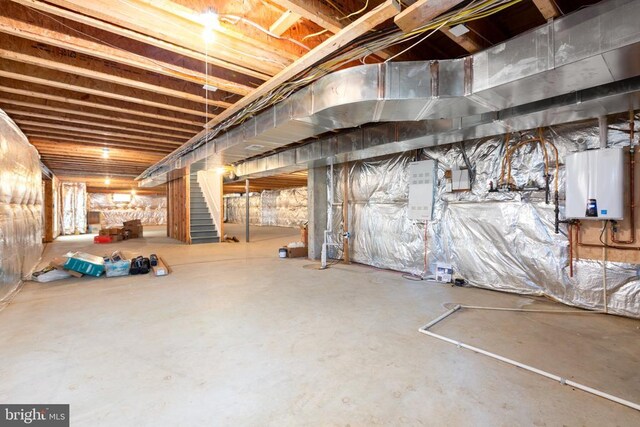 basement featuring tankless water heater