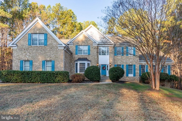 view of front of property with a front lawn