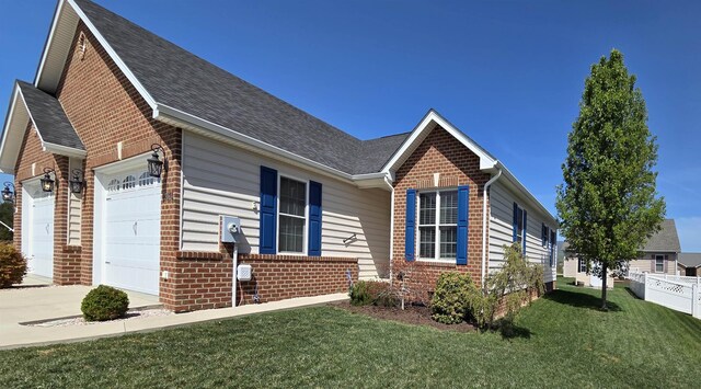 view of front of home featuring brick siding, an attached garage, a shingled roof, and a front lawn
