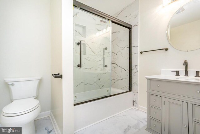 full bathroom with vanity, shower / bath combination with glass door, and toilet