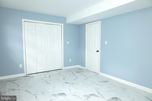 unfurnished bedroom featuring a closet