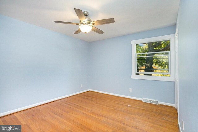 unfurnished room with light hardwood / wood-style flooring and ceiling fan