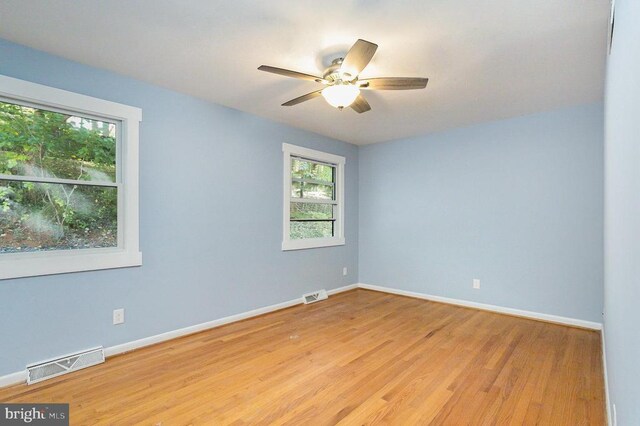 unfurnished room featuring ceiling fan and light hardwood / wood-style floors