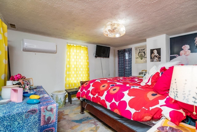 carpeted bedroom with an AC wall unit, a textured ceiling, and visible vents