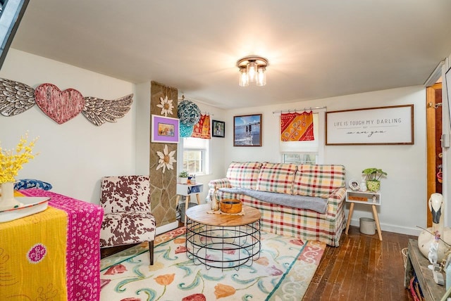living room featuring wood-type flooring and baseboards