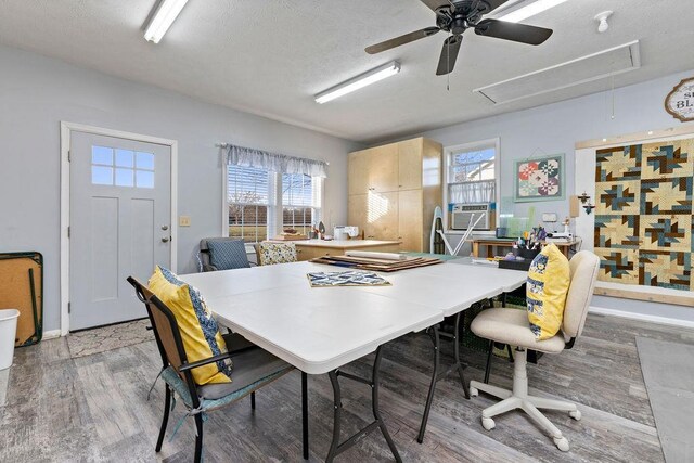 dining space with hardwood / wood-style flooring and cooling unit