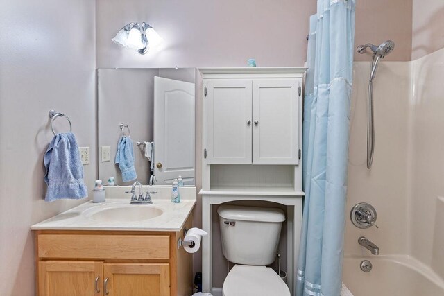 full bathroom featuring shower / bathtub combination with curtain, vanity, and toilet