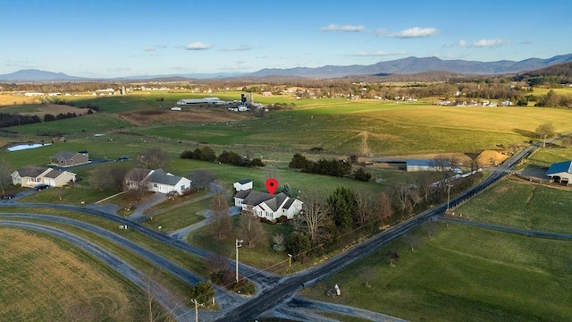 drone / aerial view with a rural view and a mountain view