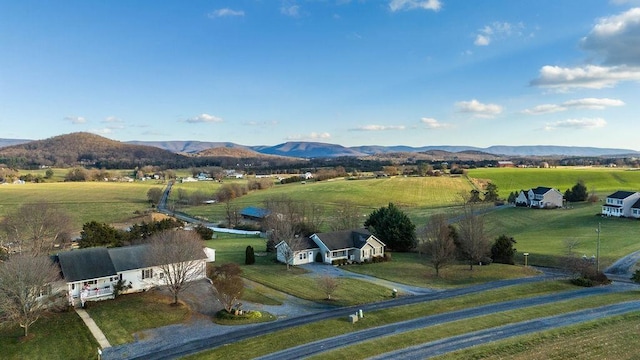 drone / aerial view featuring a mountain view and a rural view