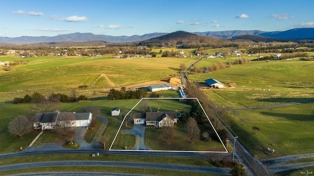 bird's eye view featuring a rural view and a mountain view