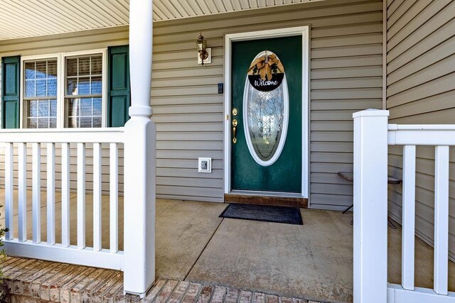 doorway to property featuring a porch