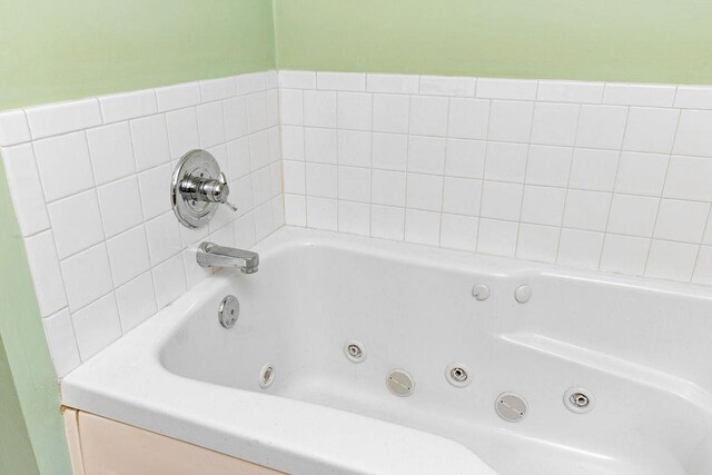 bathroom with a tub to relax in