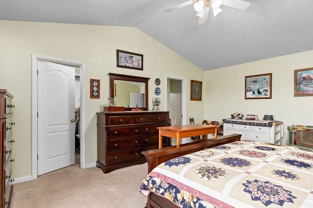 carpeted bedroom with vaulted ceiling and ceiling fan