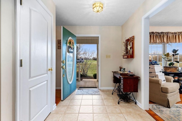 entryway with light tile patterned floors