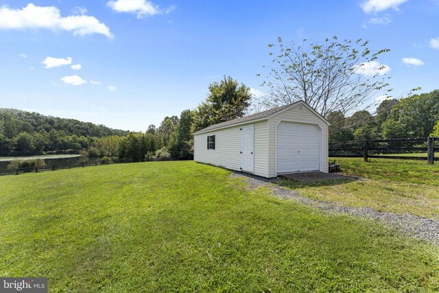 garage with a yard