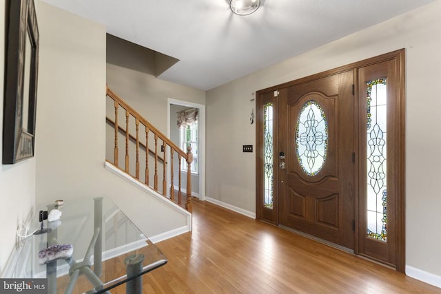 entrance foyer featuring plenty of natural light and light hardwood / wood-style flooring