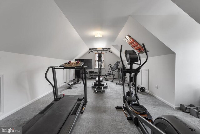 exercise room featuring vaulted ceiling