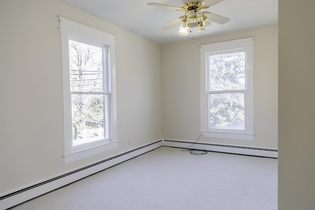 carpeted empty room with a baseboard radiator and ceiling fan