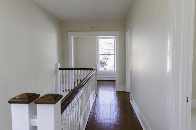 hall featuring dark hardwood / wood-style flooring and baseboard heating