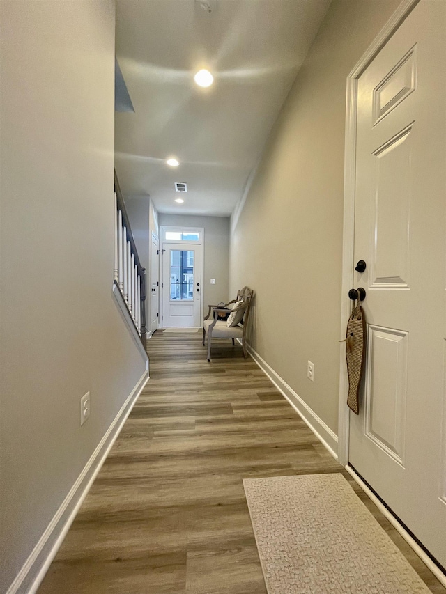 foyer entrance with hardwood / wood-style floors